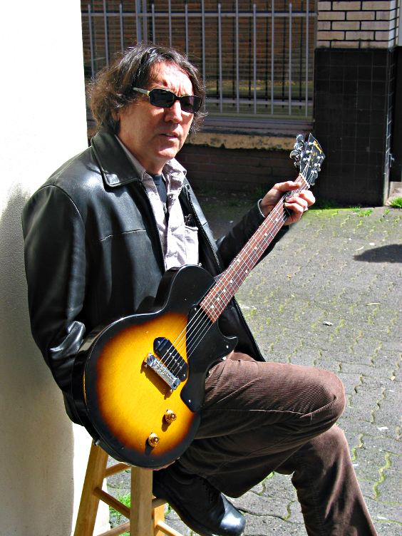 Tim poses the Les Paul Junior for me in front of Guitar Castle.